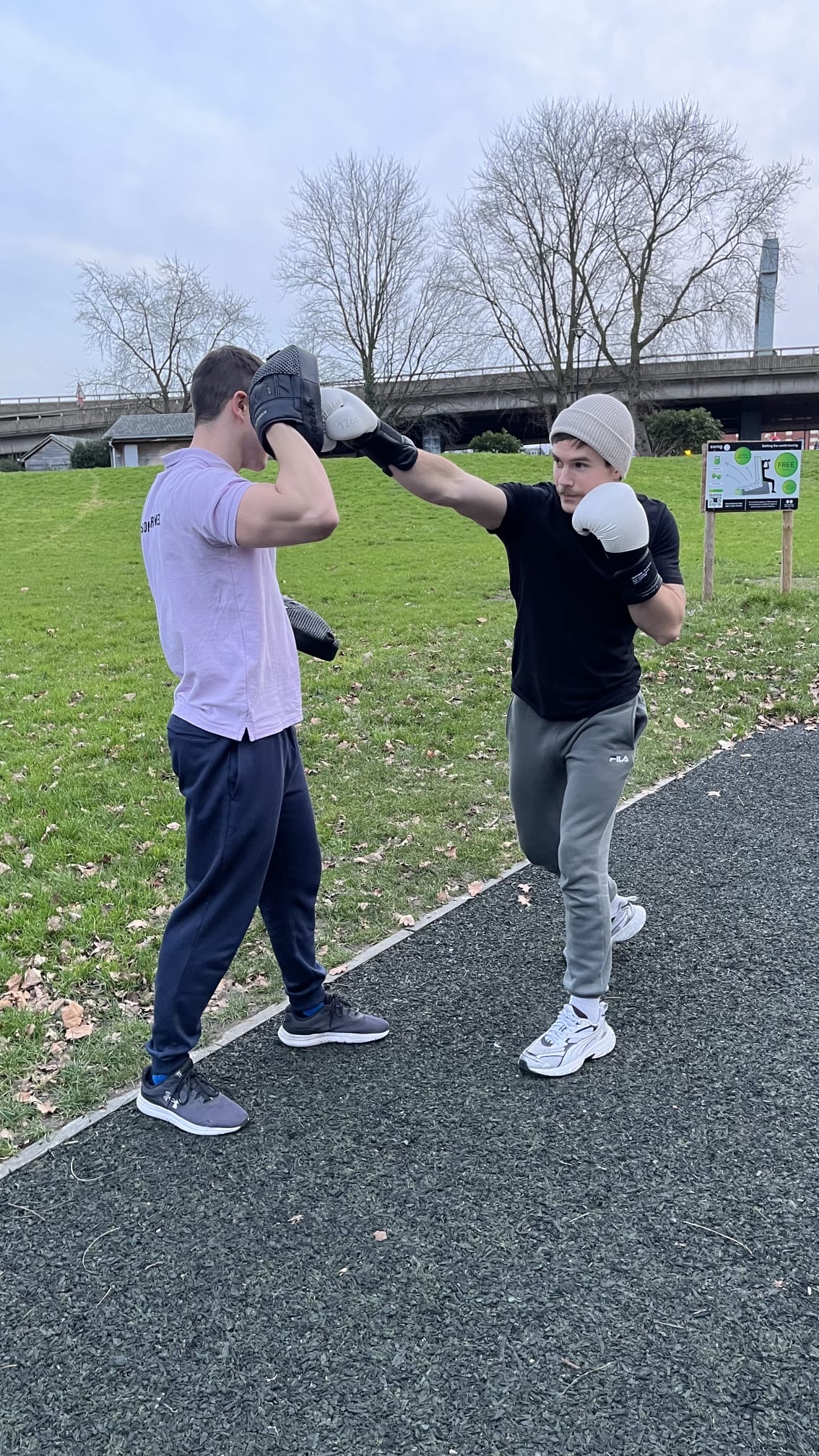 PTatHome personal trainer running an outdoor boxing session with a client